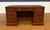 This is a traditional mahogany executive desk by Leighton Hall. It features front, side and drawer panels of swirly crotch...