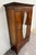 This is a stunning antique Edwardian mahogany wardrobe dating to the early 20th century. Features a striking oval mirror...