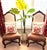 An exceptional pair of Henredon French Provincial accent chairs that beautifully showcase the craftsmanship, elegance, and...