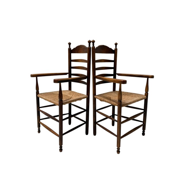 Stunning and elegant pair of Rusic ladder back armchairs. Striking Dutch design from the 1900s. Solid patinated beech...