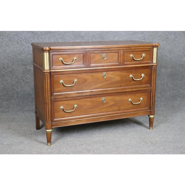 This is a gorgeous Baker 1950s commode with the styling of Maison Jansen is absolutely quintessential Baker of the 1950s...