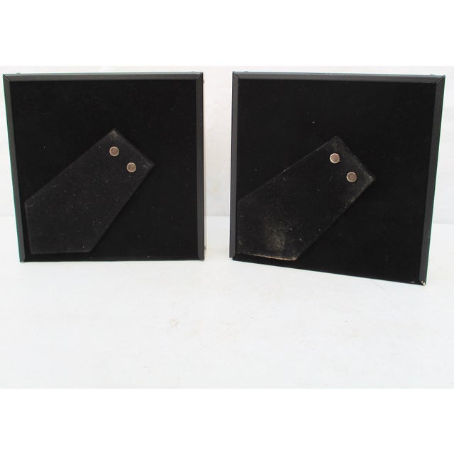 Shadowbox framed enamels of Floriano Vecchi's classical heads. Two profiles in companion colors and in companion black and...