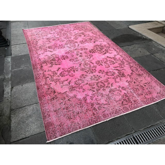 This is a vintage Turkish Oushak rug from the 1960s. The piece was hand-knotted.