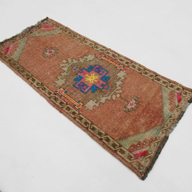 Handknotted vintage decorative mini rug from Kars region of Turkey. Approximately 50-60 years old. In very good condition.