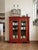 Capture the romance of global design with this mid-20th-century hand-painted Indian Almirah cabinet. Sourced from an...