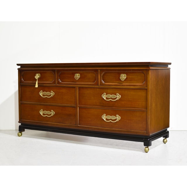 A fresh take on classic Chinoiserie style, this mid century seven-drawer dresser by Bassett Furniture combines clean lines...