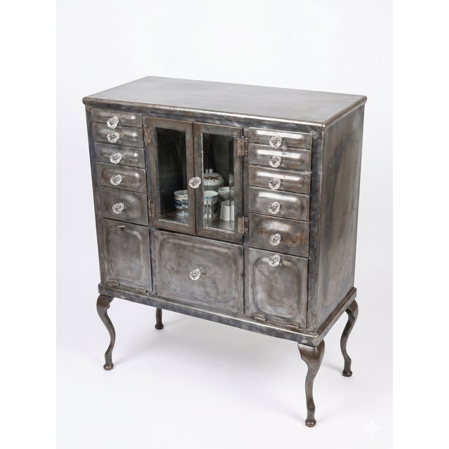 Antique industrial cabinet. Works great as a bar in the kitchen, could also make a nice element in an office. 13 drawers /...