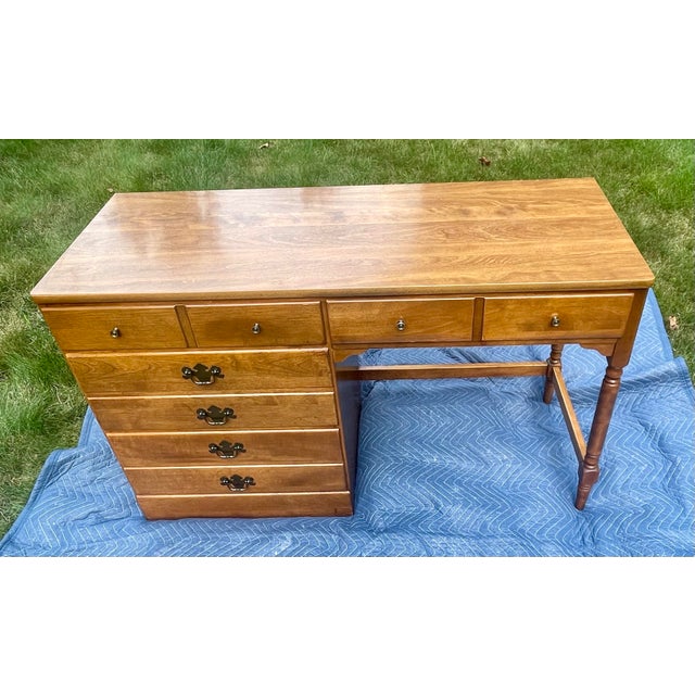 Add natural warmth and structural texture to a contemporary interior with this streamlined writing desk by Ethan Allen....