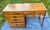 Add natural warmth and structural texture to a contemporary interior with this streamlined writing desk by Ethan Allen....