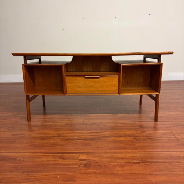 Striking Omann Jun model 75 mid-century teak desk, perfect for playing center stage in any room as it looks spectacular...