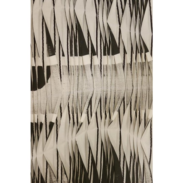 Painted tableaus and from a repetitive and random folding to the rhythms of horizontal lines images are formed to give...