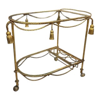 1970s Hollywood Regency Gold Tassel Motif Rolling Bar Cart With Double Glass Shelves For Sale