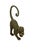 A charming cast bronze monkey sculpture, capturing a moment of curiosity and movement with a playful yet refined...