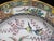 Japanese 20th century porcelain plate, measures 10 1/4". White porcelain hand painted in bold tones showing 5 roosters...
