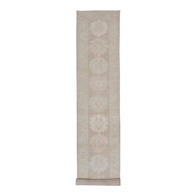 Long Soft Oushak Runner With Sand Field and Pale Green and Blue Accents For Sale