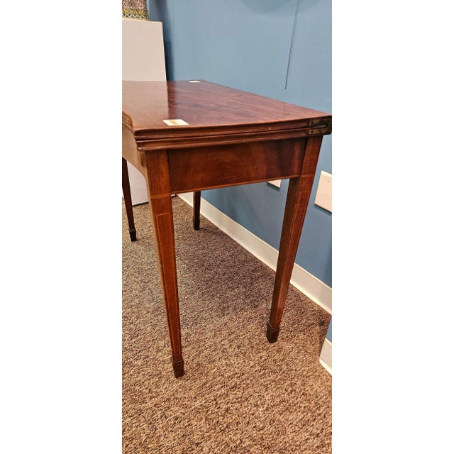 Sheraton Mahogany Games Table circa 1800, serpentine front, hinged top, leaf and line inlays