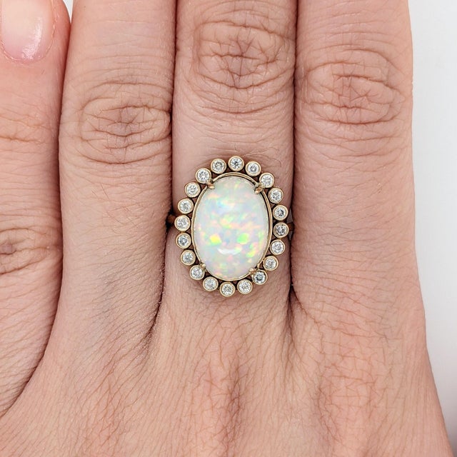 Celebrate in style with this stunning 4.98ct opal ring! Crafted from solid 14k yellow gold & accented with natural diamond...