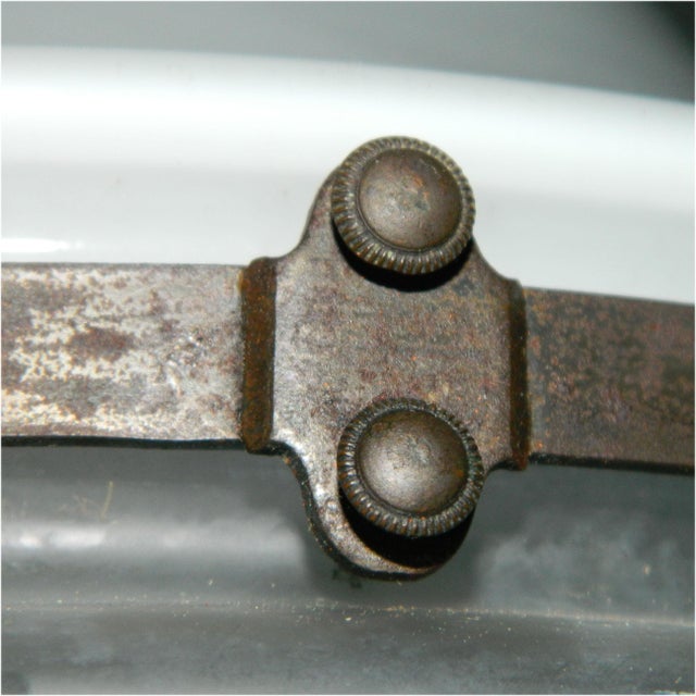 A teardrop-shaped metal ceiling light with two glass shades, designed by peter behrens for siemens schuckert werke around...