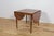 This square, extendable teak table was manufactured in Denmark in the 1960s. It has undergone a comprehensive carpentry...