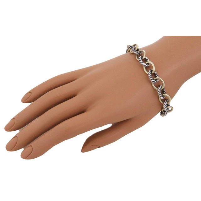 This chic authentic chain bracelet is by David Yurman, it is crafted from 18k yellow gold and sterling silver featuring...