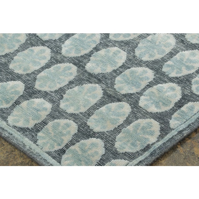 Made with hand-knotted natural silk, this 2x10 runner rug is a sophisticated addition to Rug & Kilim’s Block Print...