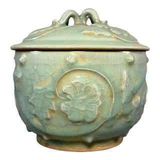 Antique Chinese Official‑Style Celadon Lidded Jar With Relief Floral Motifs For Sale