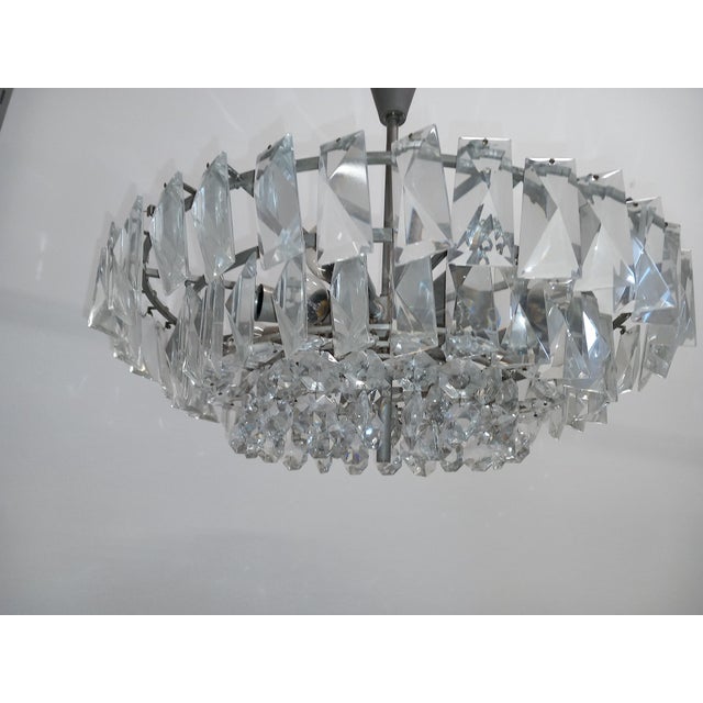 The crystal chandelier is equipped with 12x E14 sockets, metal frame is nickel plated, clean working condition. Chandelier...