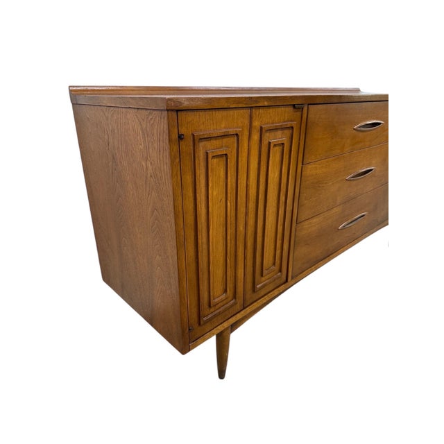 This beautiful Mid-Century Modern Broyhill Sculptra walnut sideboard is a standout example of iconic 1960s American...