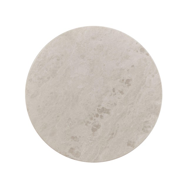 The contemporary Honed Michigan stone cone base accent table reflects a modern minimalist design ethos, characterized by...