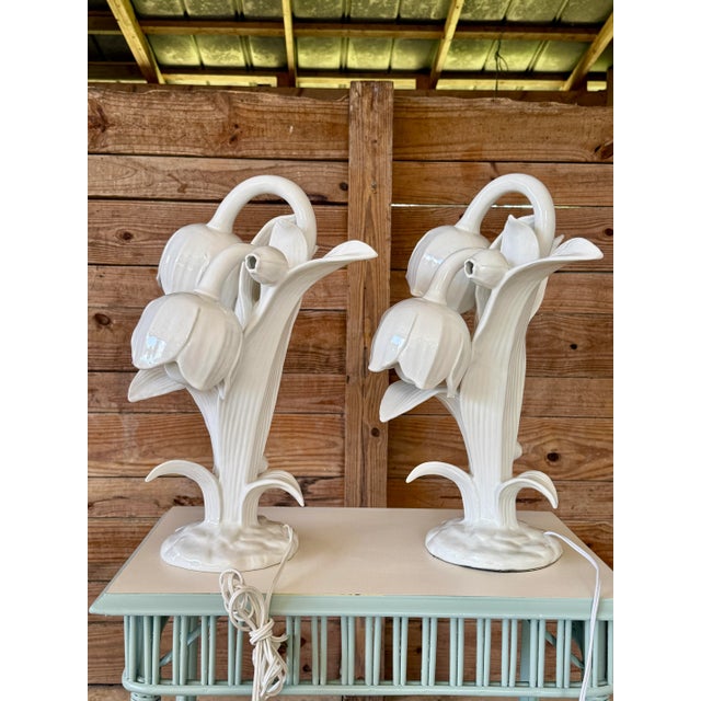 An exquisite and rare pair of Italian porcelain table lamps in the form of sculptural lily blooms, beautifully glazed in a...