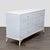 This West Elm dresser features a clean white finish with six spacious drawers for ample storage. The simple design is...