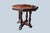 Gorgeous mahogany center table with gorgeous mirrored wood grain on the top surface. The legs of the table are a sturdy...