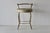 Vintage George Koch gold-finish faux bamboo vanity stool featuring a round cream upholstered seat and a low open backrest....