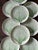Stunning set of 12 plates by high-end fits and Floyd, presented on a crisp white with a rich Kelli green outline of a...