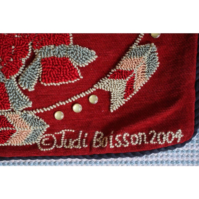 A distinctive coordinating pair of vintage 2004 Judi Boisson hand-hooked pillow covers from her American Home Collection,...