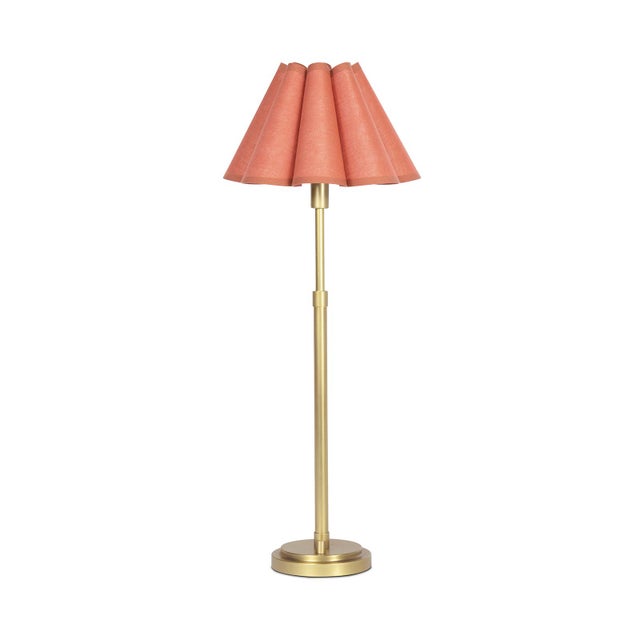 The Polly Buffet Table Lamp showcases sophistication with its single scalloped shade, casting a warm and inviting glow...
