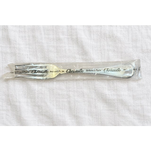 A complete unused Christofle Albi silver-plated flatware service for four, comprising four 5-piece place settings and 20...