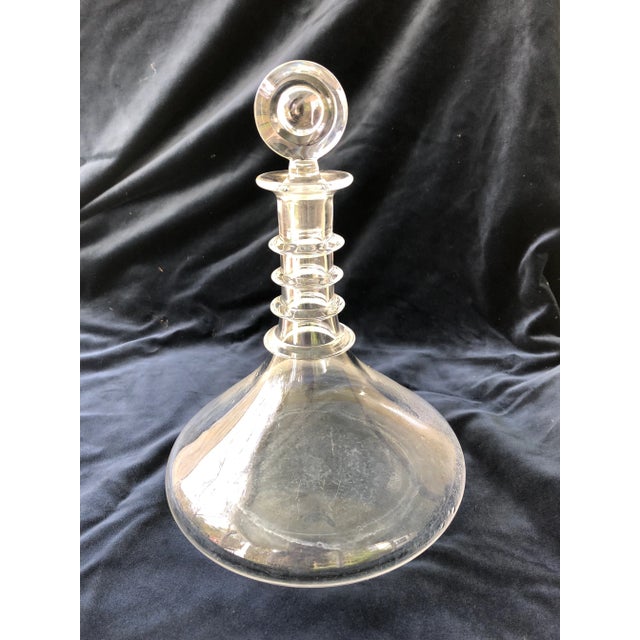 Vintage glass decanter and stopper with flat bottom. These flat bottom decanters were designed for use on ships. Their...