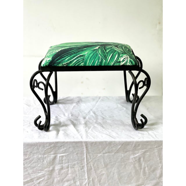 Adorable Italian vintage stool made of scrolling hand-forged iron and having four cabriole-shaped legs. The stool supports...