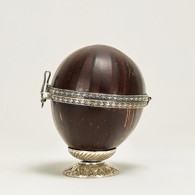 Lofty antique Anglo Indian box crafted with a polished coconut and decorated with jewelry like silvered metal work...