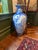 A beautiful hand painted blue and white floor vase decorated with cranes and stylized waves. This piece was made in Japan...