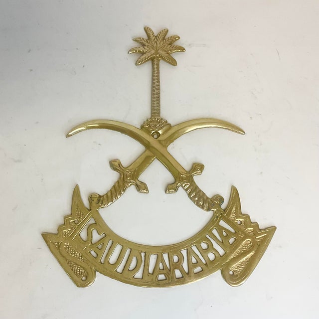 In 1950, Saudi Arabia adopted a National Emblem consisting of two crossed swords with a Palm Tree above the cross. This is...