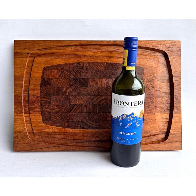 Offered is a staved and lathed Teak wood carving / charcuterie board made by ESA (Eric S. Angelo) Denmark. It features an...