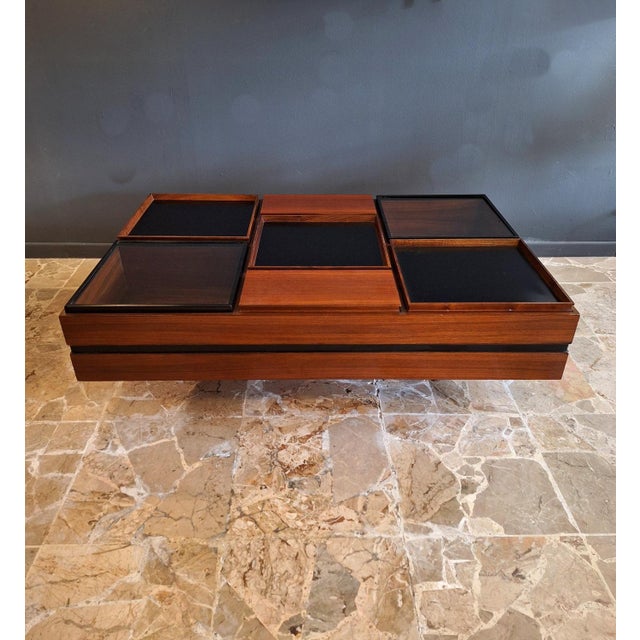 Functional and compartmentalized coffee table in teak wood designed by Carlo Hauner and produced by Forma Italy in the...