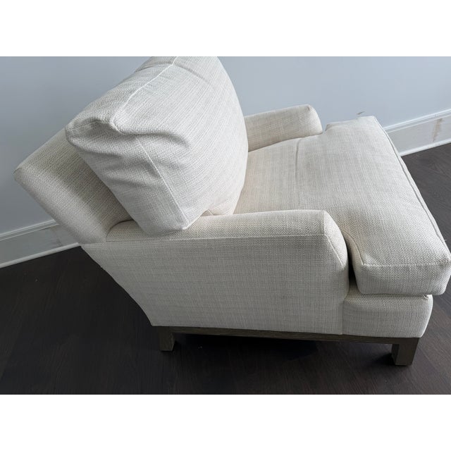 Pair of A. Rudin No. 681 lounge chairs, upholstered in ivory and beige textured woven fabric with subtle tonal striping....
