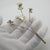 A long vintage miniature depicting an orchid branch, handcrafted in Continental Silver (800/000) in Italy between the...
