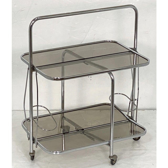 A handsome French bar cart table or cocktail drinks trolley in the Art Deco style, from the Mid-Century Modern period,...