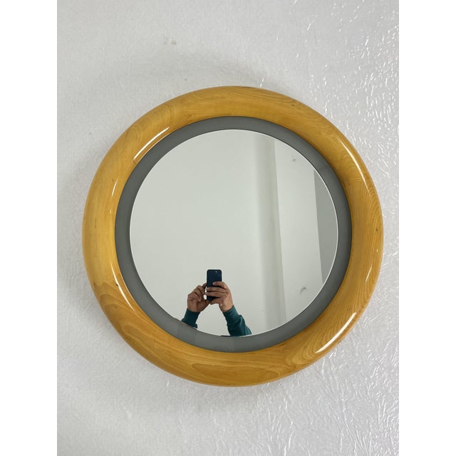 Backlit circular wall mirror made in Italy from the 70s Beech wood structure, diameter 73 cm. Mirror intact, good condition.
