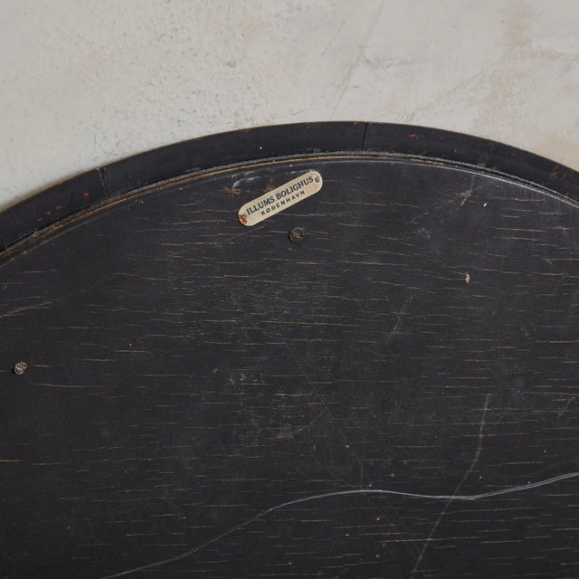 A Scandinavian Modern round wall mirror by Bodil Hagedorn Eje. Daughter of painter Thorvald Hagedorn-Olse, Bodil Eje was a...