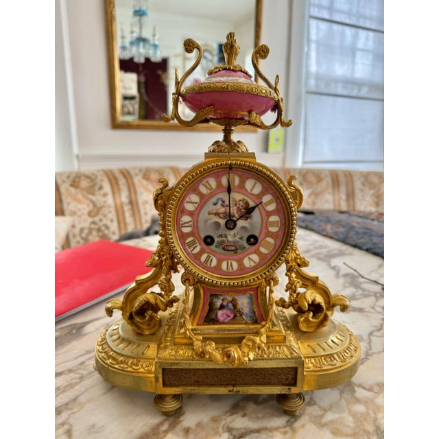 Gorgeous gilded signed French clock. Beautiful hand painted porcelain details, no key and I don’t know if it works. Made...